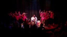 Young performers on stage at The Rosette during a community concert.